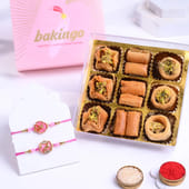 Stone Studded Floral Rakhi Duo With Sweet Treats