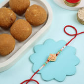 Pastel Floral Rakhi With Besan Ladoos