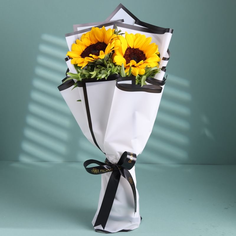 2 Sunflower Wrapped In White China Paper