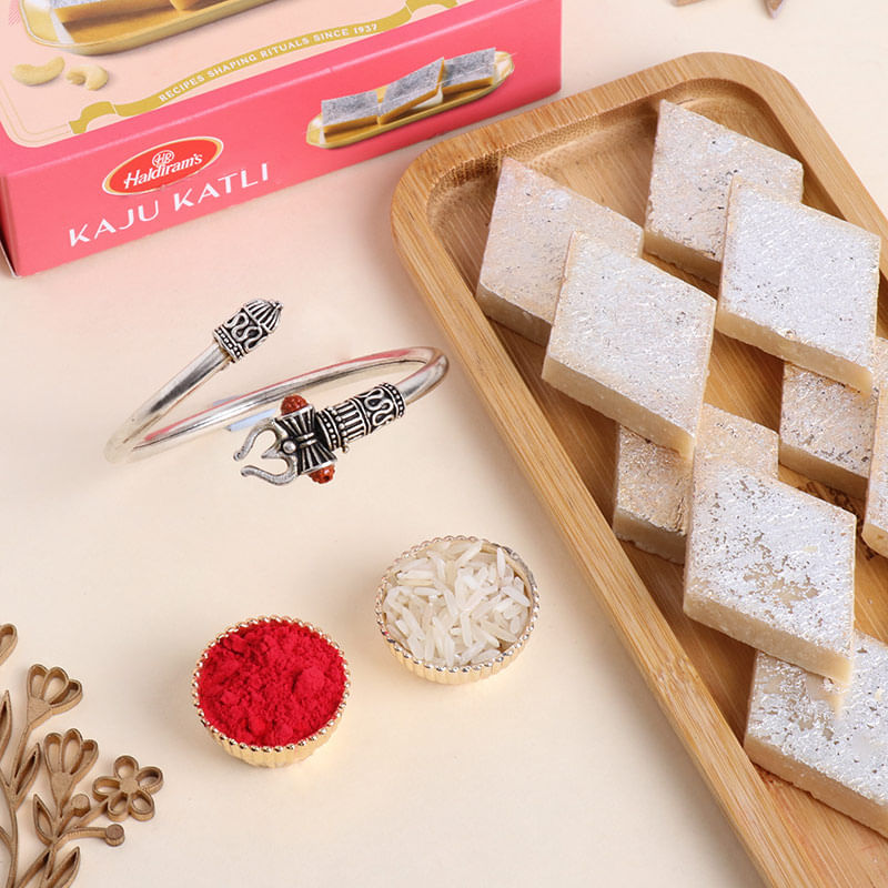 Mighty Om Rakhi with Sweets