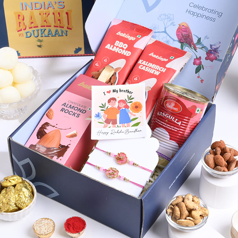 Two Floral Pink Rakhis With Gourmet Festive Treats