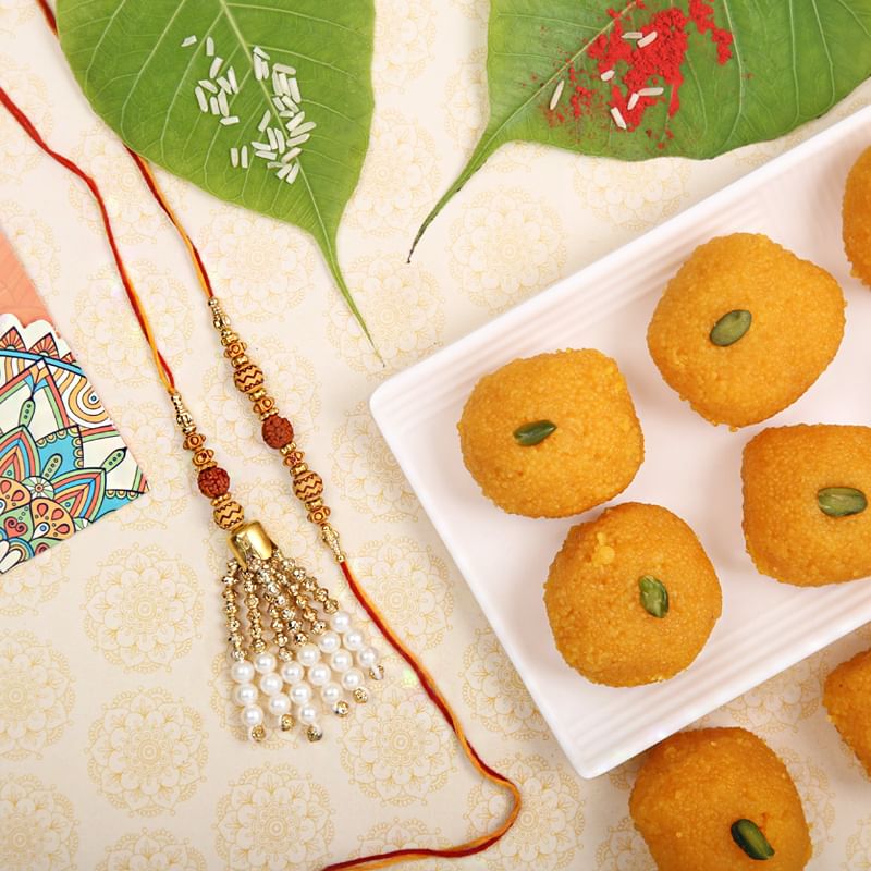 Sweet Rudraksha Lumba Rakhi Combo - Set of Bhaiya Bhabhi Designer Rakhi with Roli and Chawal and 500gm Motichoor Laddoo