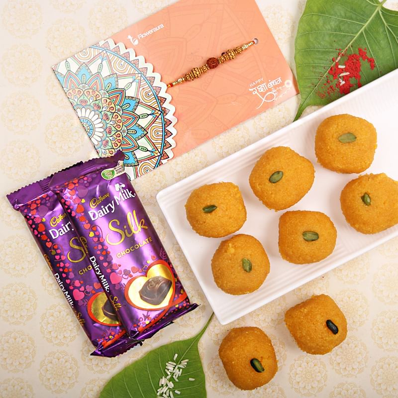 Rakhi with Two Dairy Milk Silk and Half Kg Besan Laddu