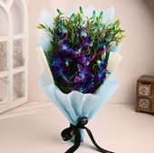 5 Blue Orchids In Blue Paper