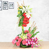 Mixed Color Carnations Lilies and Orchids in Basket