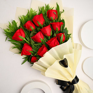 Bouquet of 12 Red Velvet Roses in White paper packing
