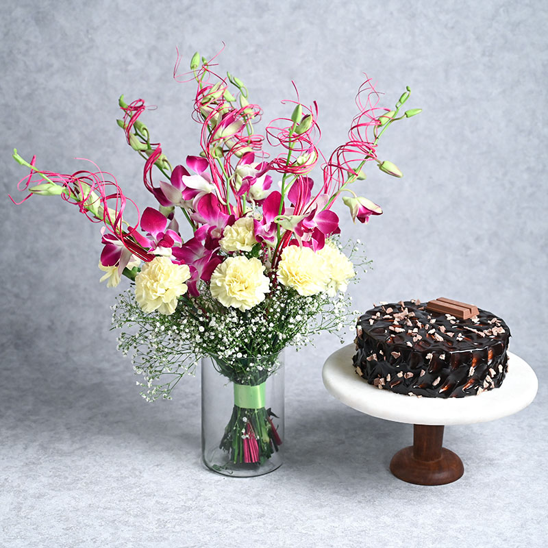 Orchids Carnations Glass Vase with Kitkat Cake: Flower and cake delivery
