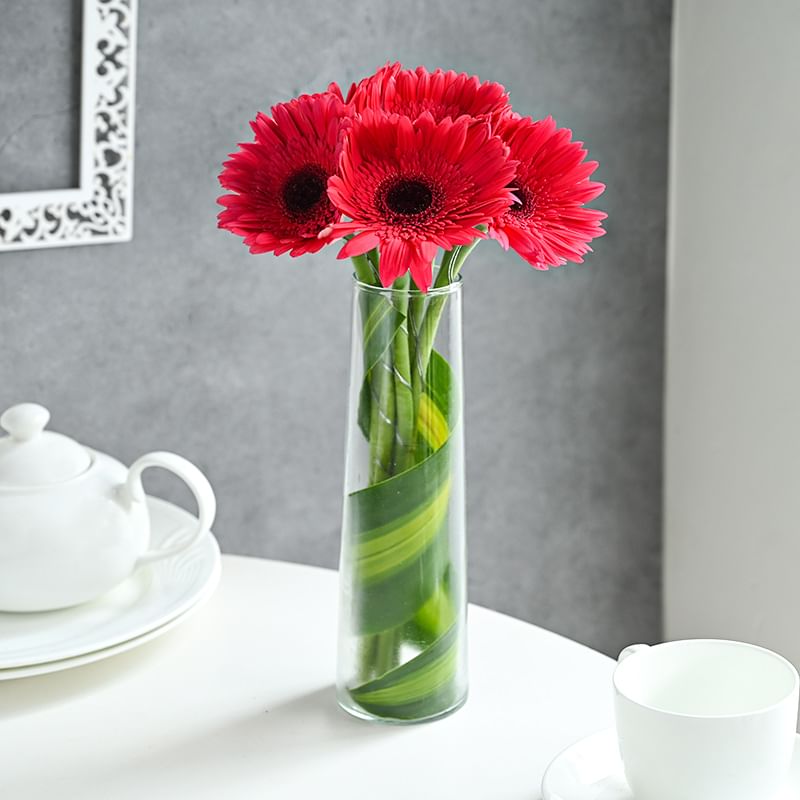 Pink gerberas in glass vase - Buy Online