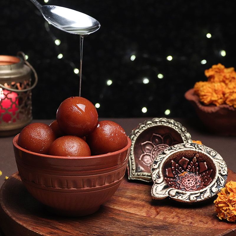 Sweetilicious Combo - 1 Kg Haldiram Gulab Jamun with 2 Designer Diyas