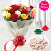 Yellow, white, red and pink flowers bunch with kaju Kathli and gulal for Holi