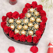 A 25 Red Roses in a heart-shaped with 16 Ferrero Rocher chocolates