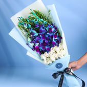 Bouquet of 10 pristine white Roses and 6 graceful Orchids