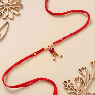 Radiant Red Stone And Pearl Rakhi