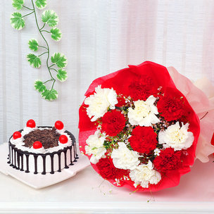 Reindeers Special - A gift combo of red and white carnation with half kg black forest cake