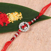 Shining Red Dori Rakhi With White Metal Rakhi