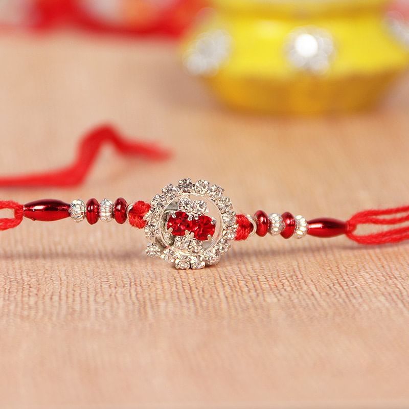 Shining Red Dori Rakhi With Silver Metal Rakhi