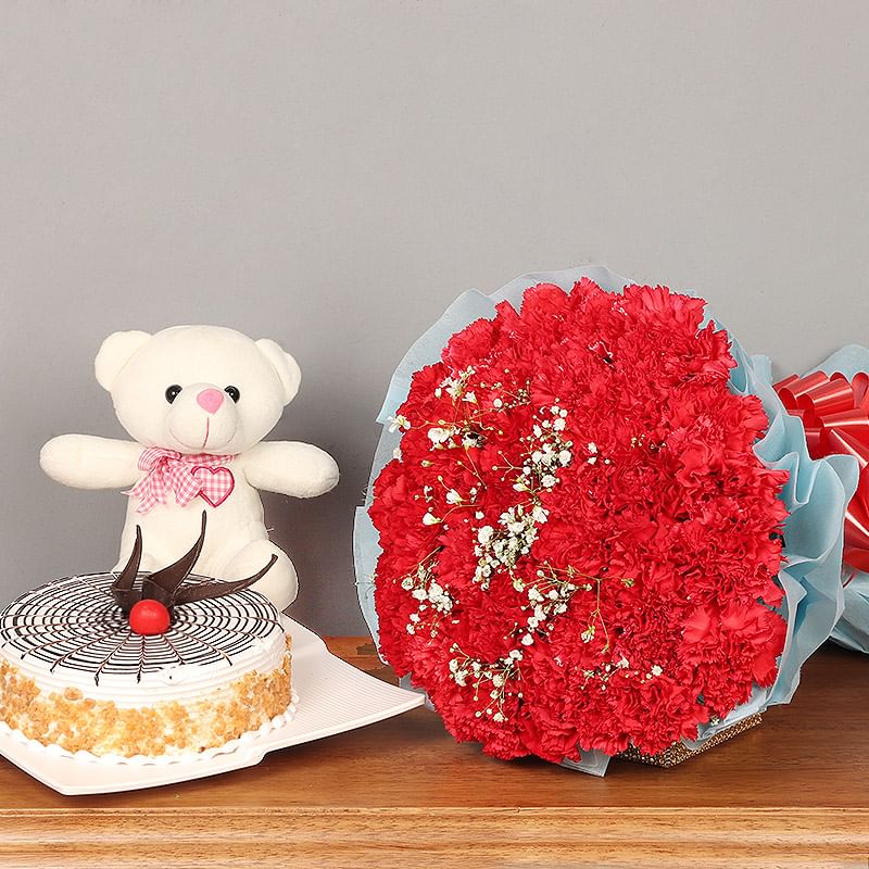 Unforgettable Moments:Bunch of 25 Red Carnations, Butter Scotch Cake and 6 inch Teddy