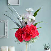 Order Alluring Carnations With Vase Gift