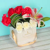 Anniversary Florals - Bouquet of 7 Red and White Carnations with 1 Pink Lily in White Flower Box