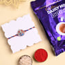 Auspicious Ganesha Rakhi With Dairy Milk Buttons