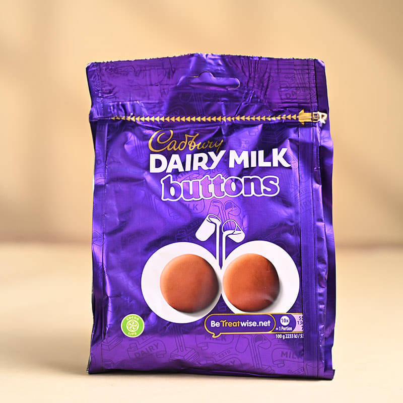 Auspicious Ganesha Rakhi With Dairy Milk Buttons