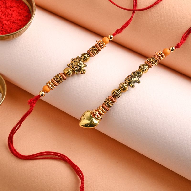Send Austere Couple Rakhi Set to USA for Bhaiya bhabhi Online