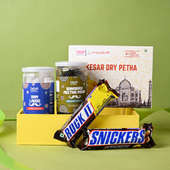 Authentic Delight Gift Hamper with Dry kesar petha, Ram ladoo, banarsi meetha paan along with some chocolates for Rakhi