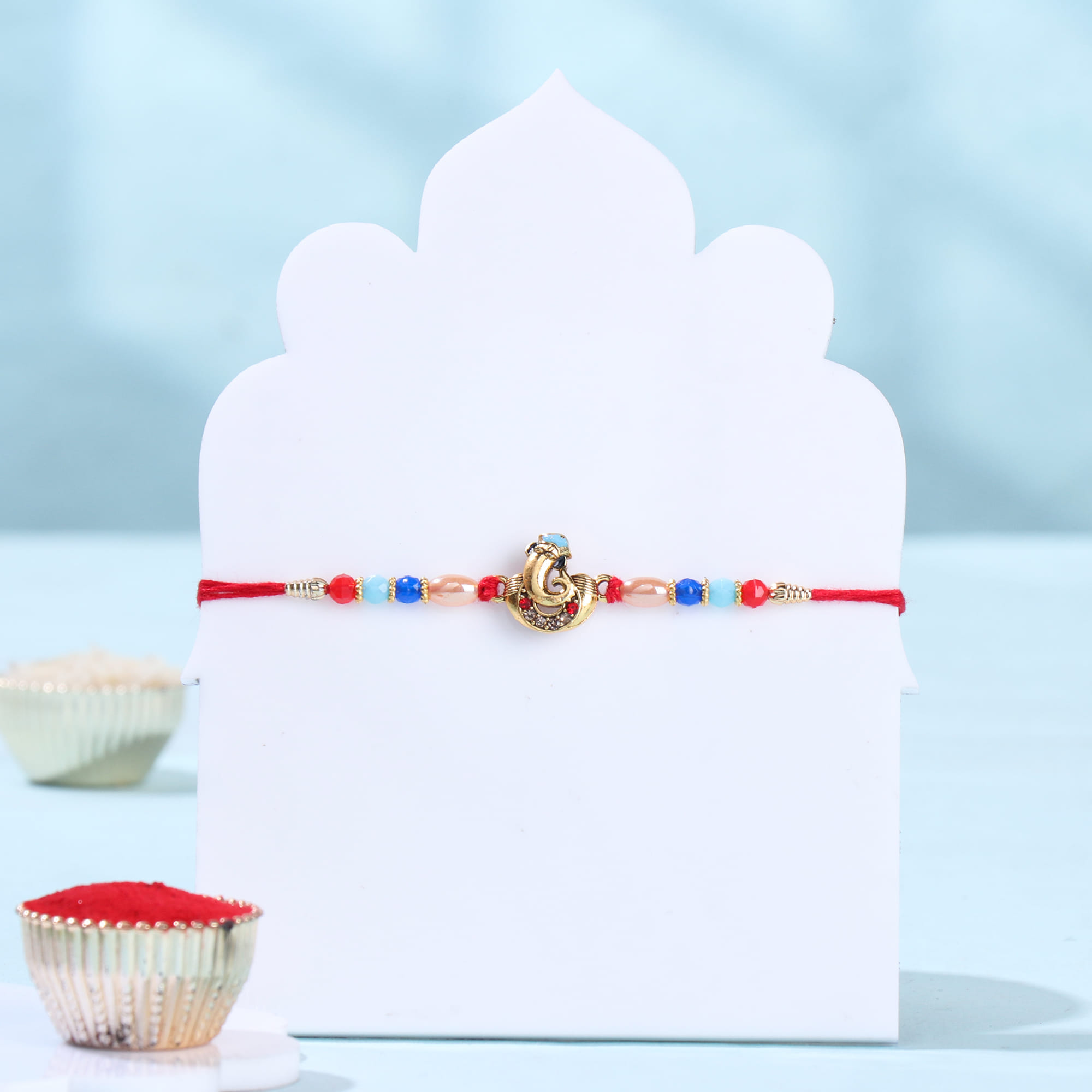 Beaded Ganesha Rakhi With Badam Bite N Trail Mix
