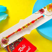 Send Beads Rakhi With Exotic Dessert Online to UAE