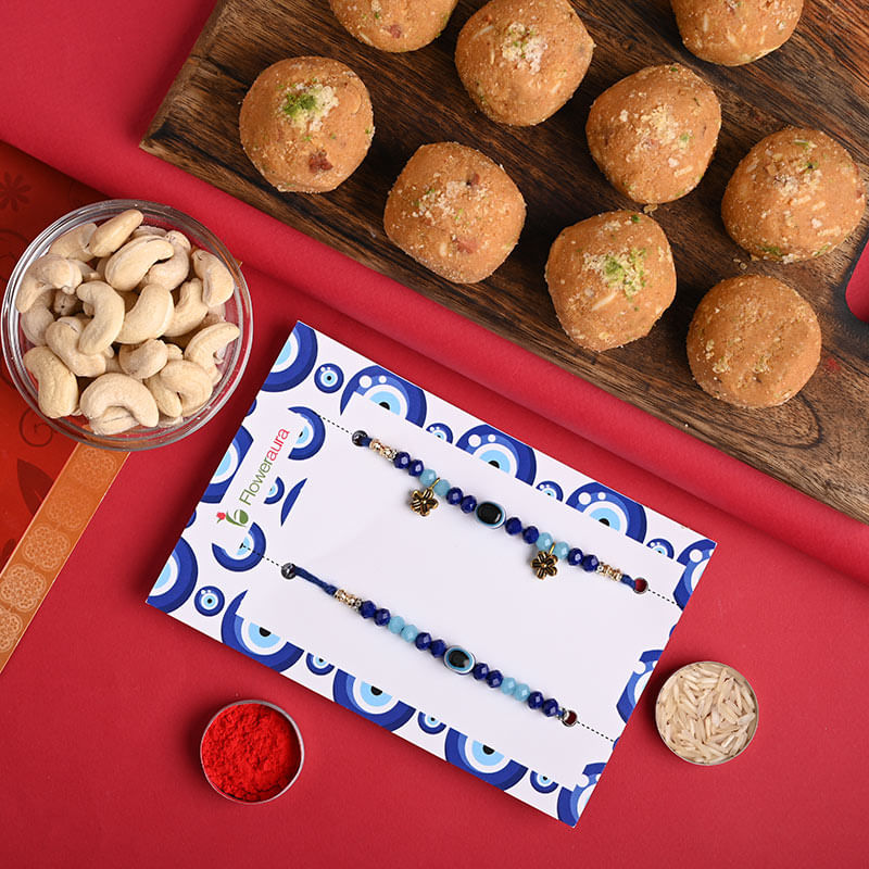 Top View of 2 Rakhi Set with Besan Ladoo N Cashew 