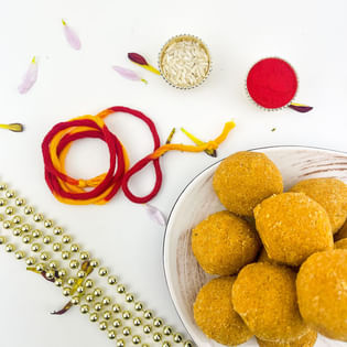 Bhai Dooj Expressions With Thread N Besan Laddoo