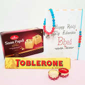 2 Designer Rakhi with Soan Papdi 250gm and Toblerone 200gm and Roli Chawal and Gift Message