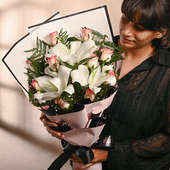 Bouquet of Pink Roses and White Lillies in a Fashion Paper