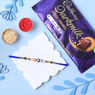 Buy Blue Evil Eye Bead Rakhi With Cadbury Dark Milk Caramel Bar