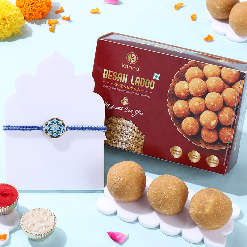 Blue Floral Rakhi With Besan Ladoos