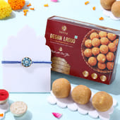 Blue Floral Rakhi With Besan Ladoos