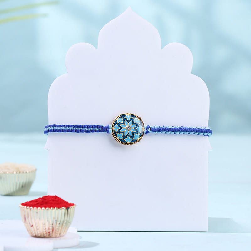 Blue Floral Rakhi With Besan Ladoos
