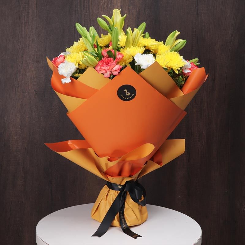 Bouquet Of Elegance - Yellow Daisy, Yellow Lilies, Orange N White Carnations(side)