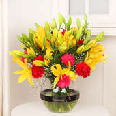 Carnation Lily Combination - Arrangement of 10 Yellow Lilies and 10 Red and Pink Carnations with Round Vase
