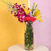 Charming Mixed Flowers In A Vase - Premium Bouquet of 12 Flowers with 6 Red Carnations and 2 Yellow Lilies and 4 Pink Orchids