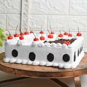 Side View of Cherry Topped New Year Cake online