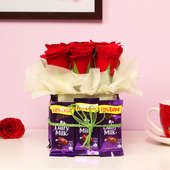 Combo of 9 Red Roses and 12 Dairy Milk Chocolates in a Glass Vase