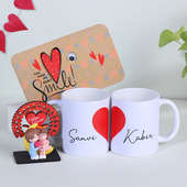Couple Mugs With Greeting Card N Mini Showpiece