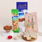 Send Couple Rakhi With Choco Almonds N Kaju Katli to Canada