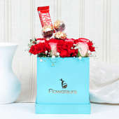 Arrangement of 8 Red Carnations & 8 Pink Roses, 3 Ferrero Rochers and 1 Nestle KitKat Chocolate 