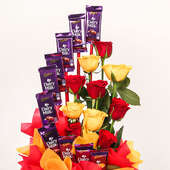 Bouquet of 10 Mixed Roses and 10 Dairy Milks in a Basket