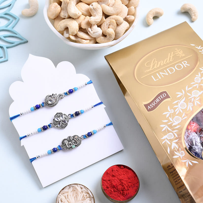 Designer Rakhi Trio With Chocolates And Cashews