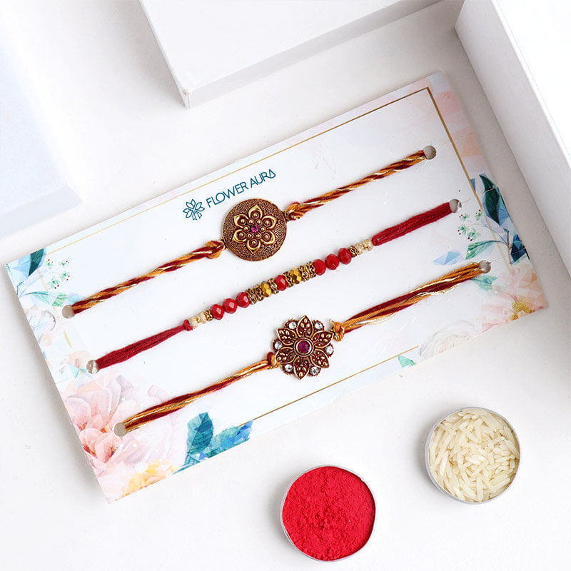 Top View of Designer Rakhi Trio With Roli and Chawal