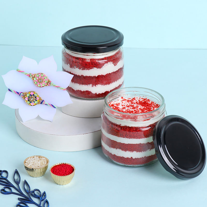 Two Floral Motif Rakhis N Red Velvet Jar Cakes