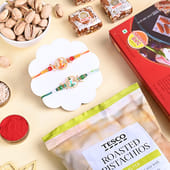Divine Ganesha Rakhi Duo With Sweets N Pistachios